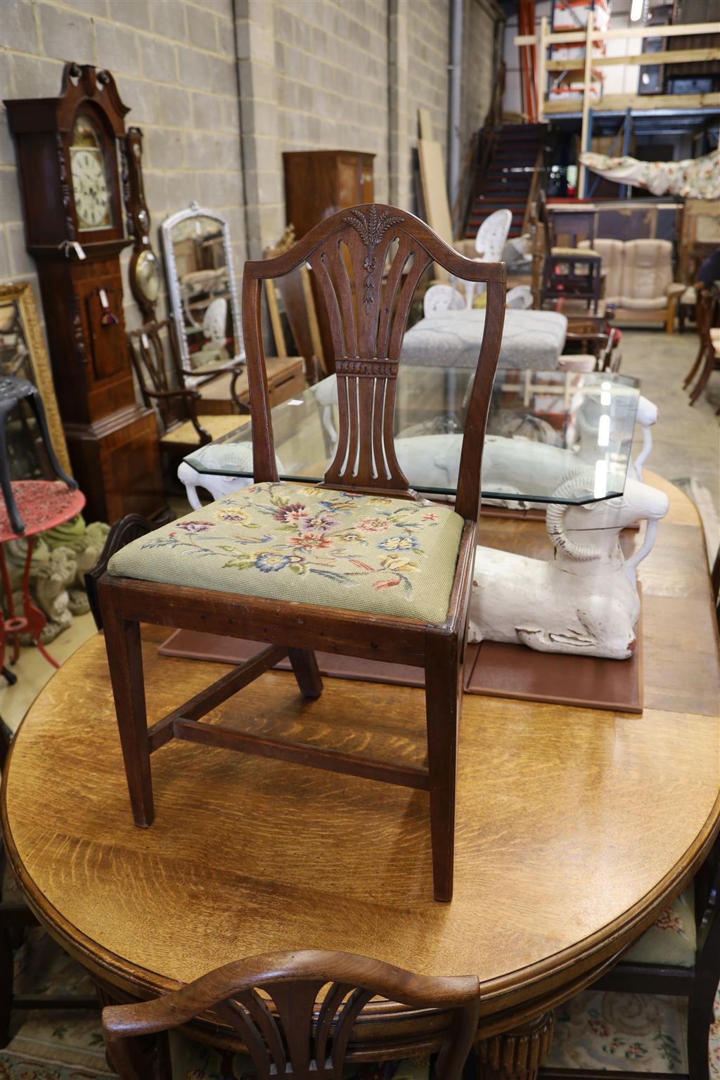 A harlequin set of eight Hepplewhite style mahogany dining chairs with tapestry drop in seats